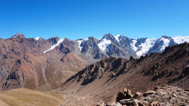 istock Rocky pass with a view of the snowy mountains 1432408200