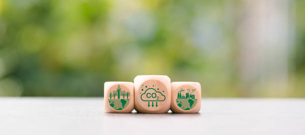 istock Industrial emissions pollute the environment and ecosystems. including climate change Carbon Renewable Energy Agreement reduce greenhouse gas emissions ,icon and wooden blocks on table 1432410335