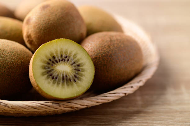 istock Fresh golden kiwi fruit in basket 1432410928
