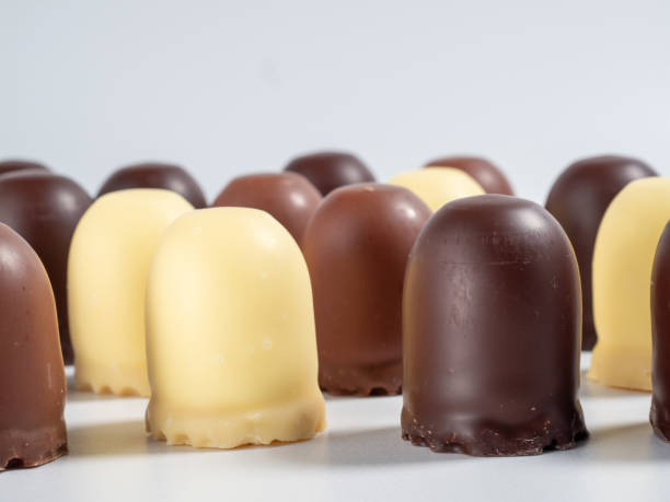 istock Marshmallow treats in chocolate on a white background. 1432410989