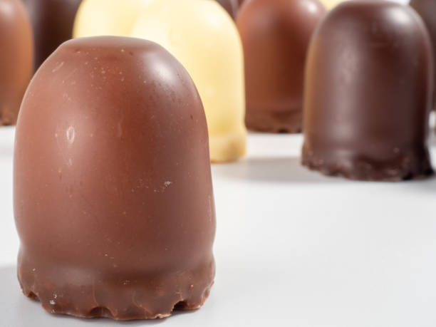 istock Marshmallow treats in chocolate on a white background. 1432411001