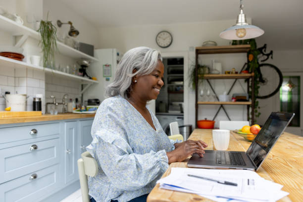 istock Happy woman at home planning a trip online 1432413350