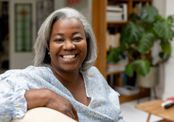 istock Happy black woman smiling at home 1432413369