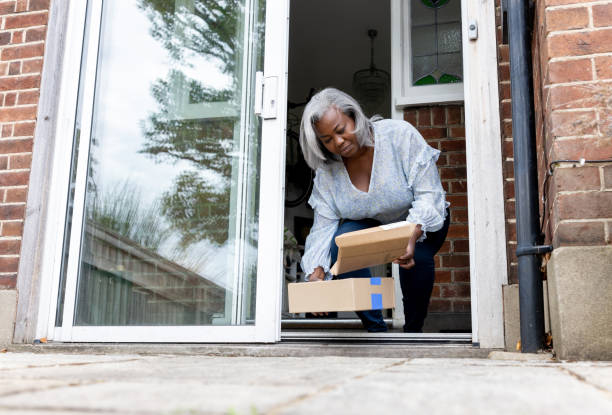 istock Woman at home receiving some packages 1432413390