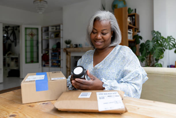 Woman opening a subscription box at home
