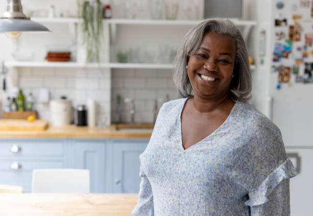 istock Happy woman smiing at home 1432413394