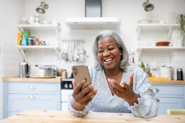 istock Mature woman at home talking on a video call 1432413431