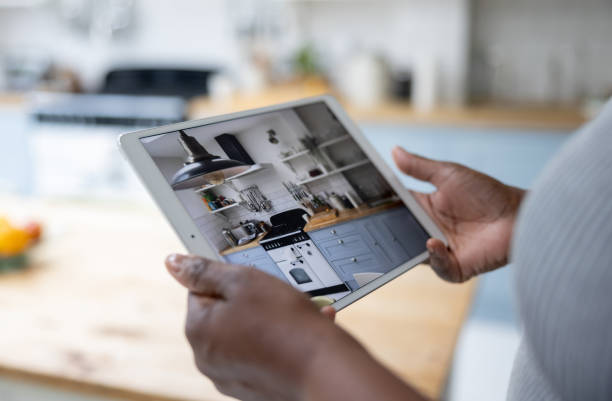 istock Woman watching the security cameras of her house using her tablet 1432413452