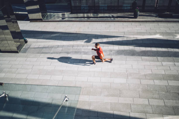 istock Male athlete doing exercises on pavement 1432420353