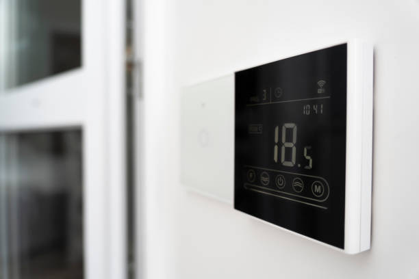 istock a device for controlling underfloor heating. air conditioner screen on wall that shows an air temperature of 18 degrees Celsius 1432420669
