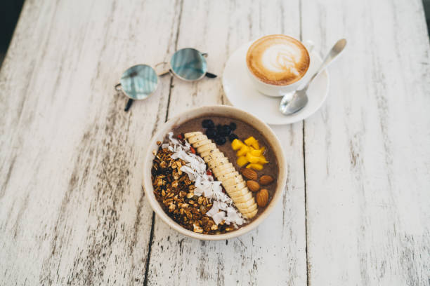 istock Cup of coffee and breakfast bowl with yogurt 1432421507