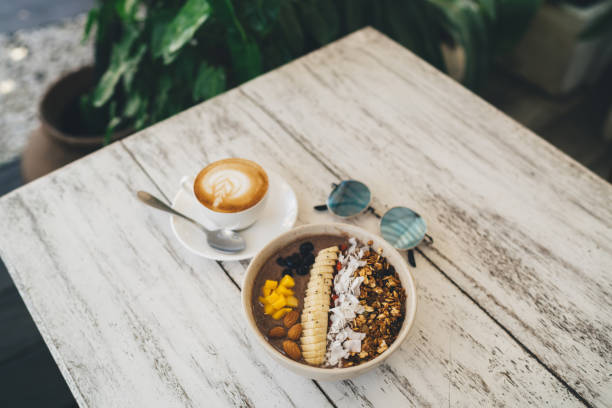 istock Delicious breakfast bowl and cappuccino on table 1432421512