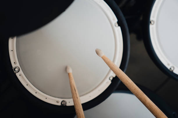 istock electronic drumsticks and drums on a dark background. Playing training drums. 1432421771