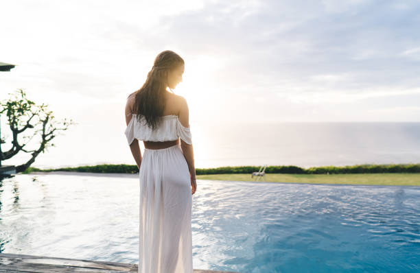 istock Anonymous woman enjoying summer landscape 1432422353