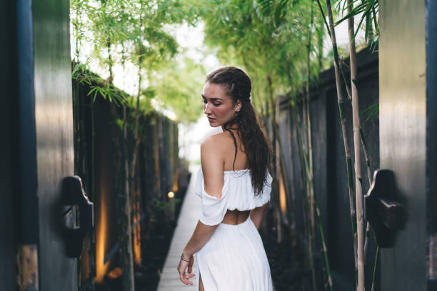 istock Elegant woman standing on wooden path 1432422366