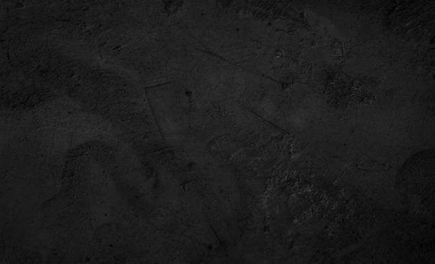 Black dark concrete wall background. Pattern board cement texture grunge dirty scratched for show anthracite promote product urban floor and abstract paper design element decor. Blackboard blank.