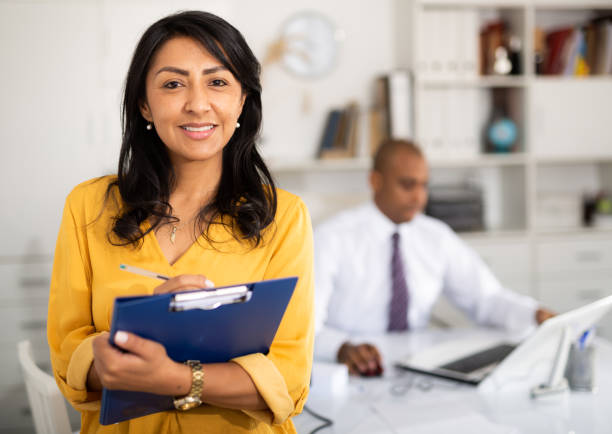 istock Secretary of the chief physician in protective mask is standing with documents 1432426820