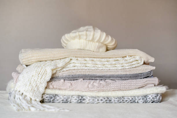 istock Lots of winter clothes, wool, sweaters, blankets, hat and scarf. 1432426916