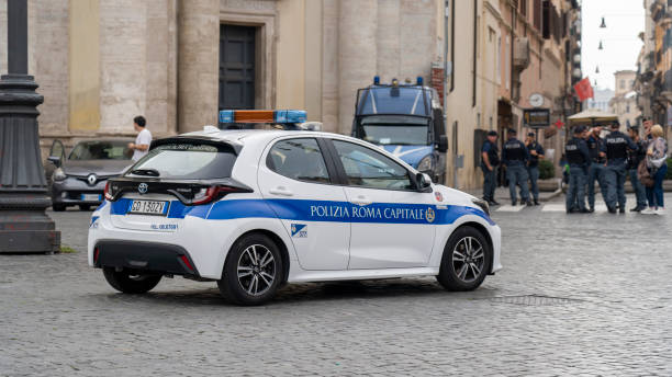 Roma, Italy. Italian traffic wardens police car in action in the streets of the city of Rome. Toyota Yaris model car. Police security car stock photo