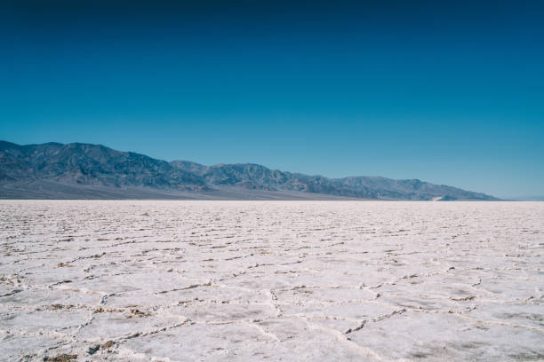 istock Cracked dry mountainous terrain with clear sky 1432429152