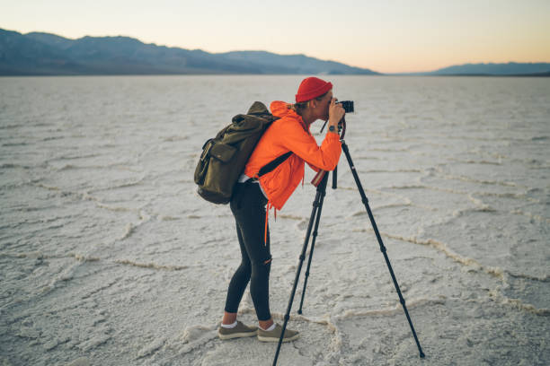 istock Anonymous traveler taking picture on photo camera 1432429157