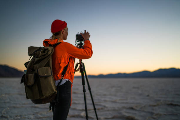 istock Unrecognizable female hiker shooting mountains in valley 1432429159