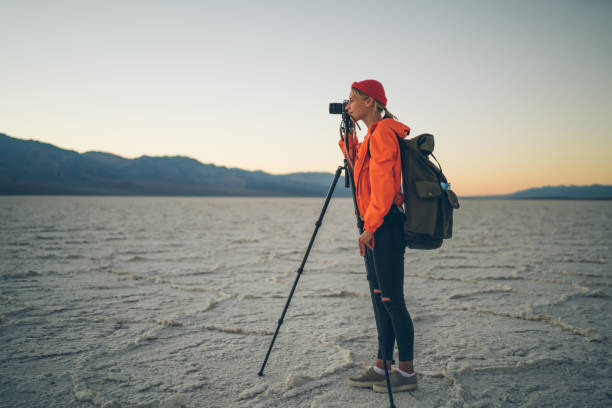 istock Female tourist with tripod in nature 1432429167