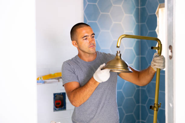 istock Man assembling tubes of new shower in bathroom 1432431667