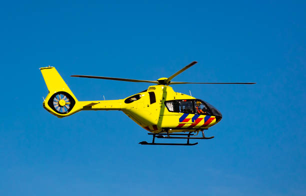 istock Flying yellow rescue helicopter with working propeller 1432431874