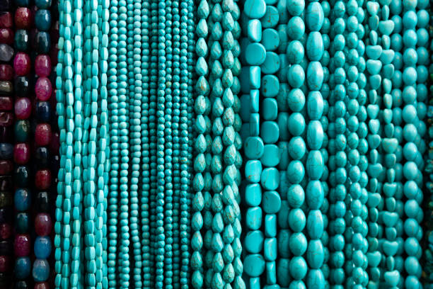 istock Beads from turquoise strung on threads in jewelry accessories store 1432431927