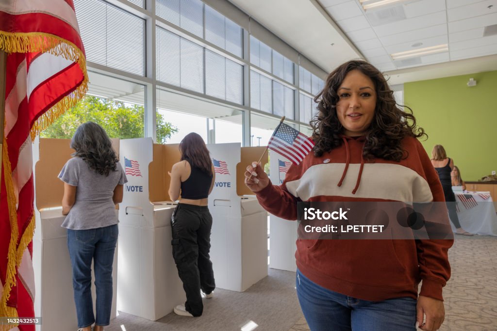 Voting A Native American woman voting at a local community center. Women Stock Photo