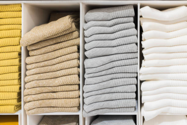 istock Multi colored socks stacked on shelves in the store 1432433602
