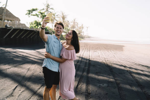 istock Joyful couple taking selfie on coast 1432433833