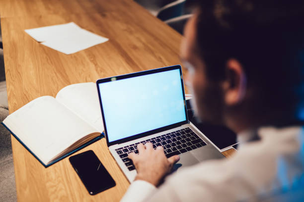 istock Anonymous manager typing on laptop in office 1432433884