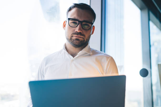 istock Serious strict businessman working in office 1432433915