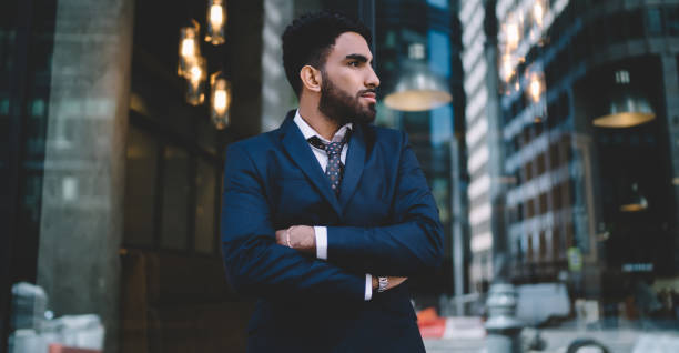 istock Pensive stylish ethnic manager contemplating work in office 1432434148