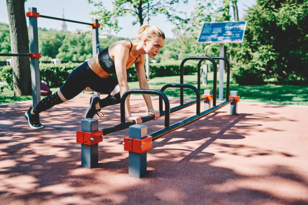 istock Serious female doing workout exercise at sports ground 1432435010