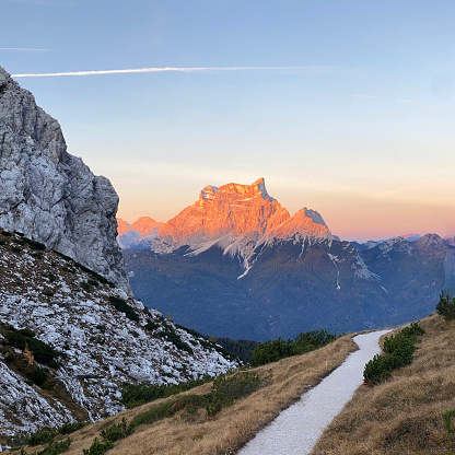 View on Seceda with birds flying over the peaks. Trentino Alto Adige, Dolomites Alps, South Tyrol, Italy. Val Gardena. Majestic Furchetta peak. Odles group seen from Seceda, Val Gardena.