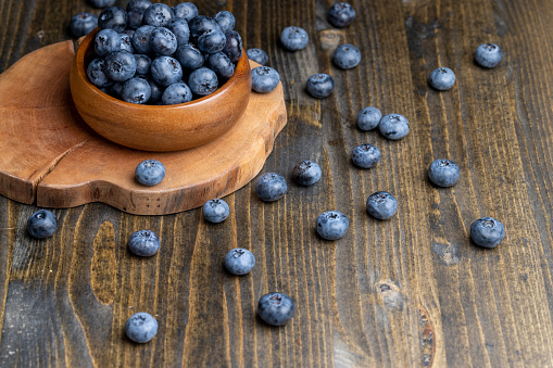 Ripe but long-lying blueberries on the table