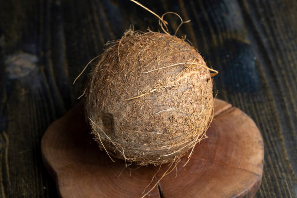 istock unpeeled mature coconut close up 1432437682