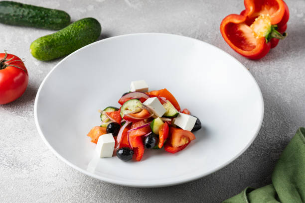 istock Grapefruit mix fruits salad serving with cheese and fresh vegetables, Two fresh salad bowls 1432437900