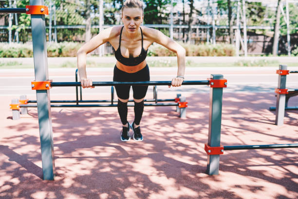 istock Sport woman doing push up exercise in stadium 1432438182