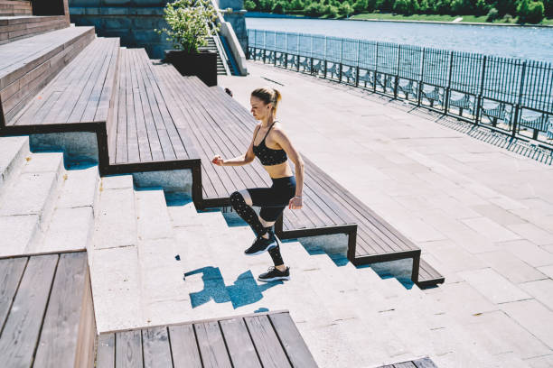 istock Concentrated lady doing fitness exercise on seafront 1432438213