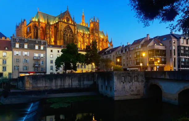 Night view of gothic cathedral of Metz illuminated by yellow light.   Roman Catholic cathedral in Metz, France Europe