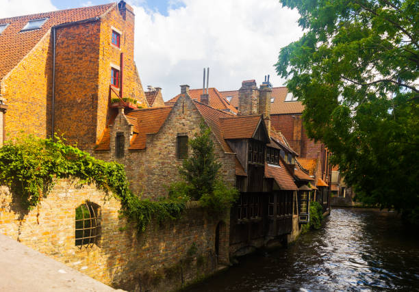 istock Stone buildings along canal in Bruges, Belgium 1432442490