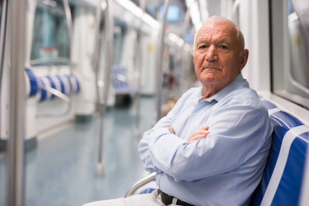 istock Elderly man in subway car 1432442936