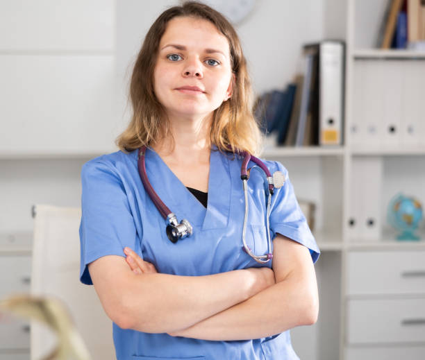 istock Woman doctor standing inside office, looking at camera 1432443127