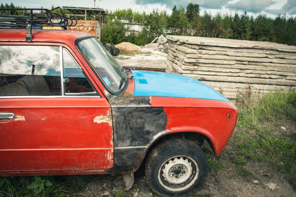 istock an old broken classic car abandoned on the street. stainless old machine 1432447359