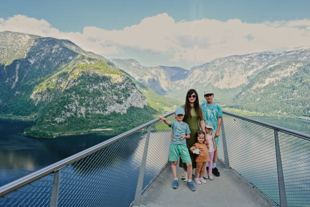 istock Mother with children at observation bridge in Hallstatt, Austria. 1432447629