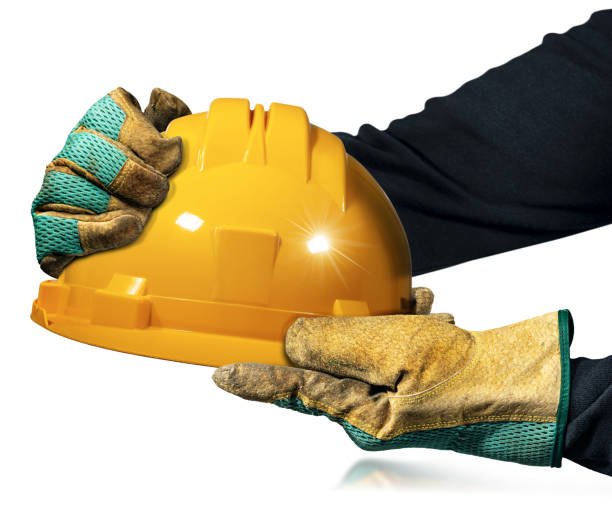 istock Gloved Hands holding an Orange Safety Helmet Isolated on White Background 1432448851